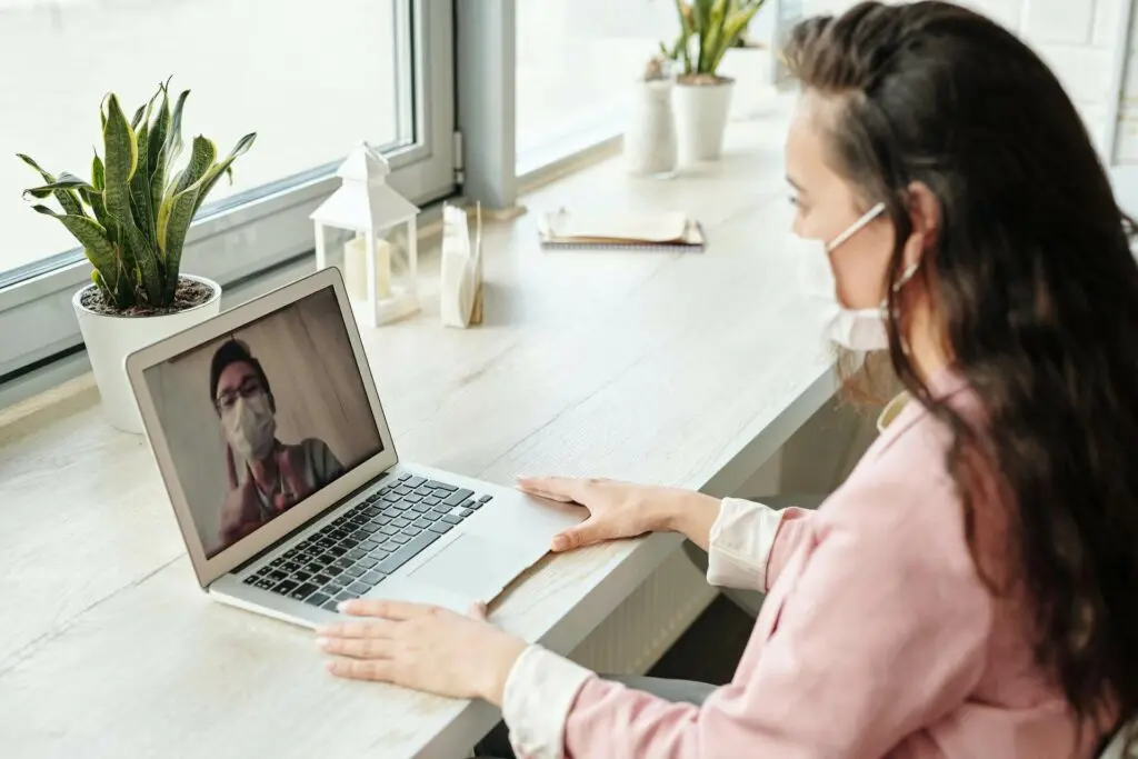 Man and Woman in video conference.